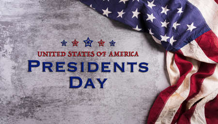 Happy presidents day concept with flag of the United States on dark stone background.の写真素材