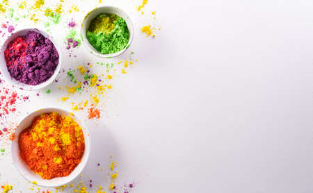 Happy Holi decoration, the indian festival.Top view of colorful holi powder on white background.の写真素材