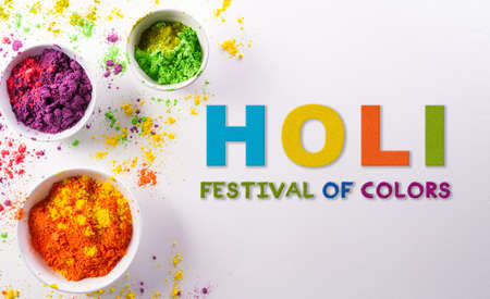 Happy Holi decoration, the indian festival.Top view of colorful holi powder with the text on white background.の写真素材
