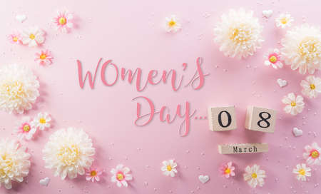 Happy Women's Day decoration concept made from flower and wooden calendar on pink pastel background.の写真素材