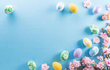 Happy easter! colourful Easter eggs with flower on pastel blue background.の写真素材