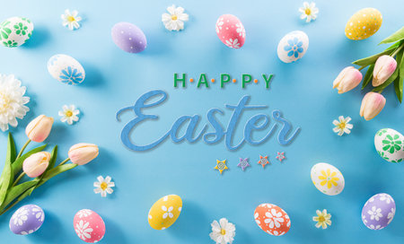Happy easter! colourful Easter eggs with flower and the text on pastel blue background.の写真素材
