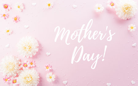 Happy Mother's Day decoration concept made from flowers and the text on pink pastel background.の写真素材
