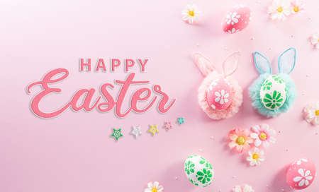 Happy easter decoration concept. Colourful Easter eggs with flowers and the text on pink pastel background.の写真素材