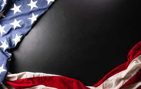 Happy memorial day concept made from American flag on dark wooden background.