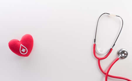 World blood donor day, red cross and nurse day concept made from red heart and stethoscope on white background.の写真素材