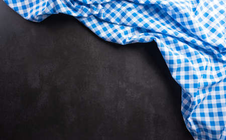 Oktoberfest festival decoration symbols made from  Bavarian white and blue fabric on dark stone background.の写真素材