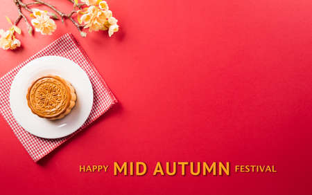 Chinese Mid-Autumn Festival concept made from mooncakes, tea and plum blossom.の写真素材