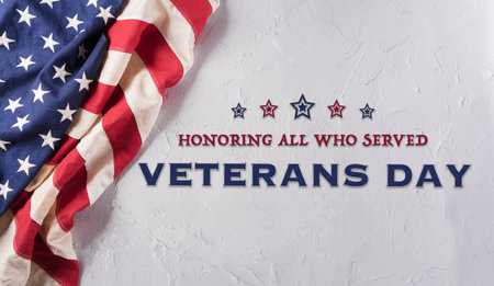 Happy Veterans day concept made from American flag and the text on white stone background.の写真素材