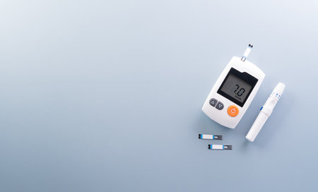 World Diabetes day concept ,14 November. Top view of blood glucose meter sets on pastel blue background,の写真素材
