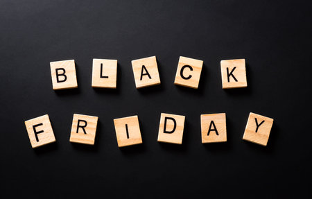Top view of Black Friday background concept made from  wooden alphabet on black background. Shopping concept boxing day and Black Friday composition.の写真素材