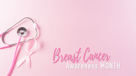 Pink ribbons and stethoscope on pastel background, Symbol of women's breast cancer awareness, Health care and medical concept.の写真素材