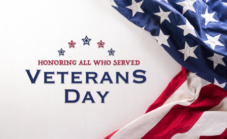Happy Veterans Day concept. American flags and the text against white background. November 11.の写真素材