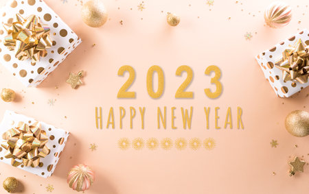 Happy new year celebration background concept made from champagne and glasses, gift box and christmas ball on pastel background.の写真素材