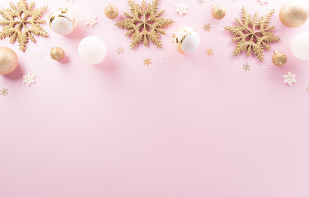 Christmas and new year background concept. Top view of Christmas ball, star and snowflake on pastel pink background.の写真素材