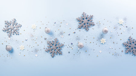 Christmas and new year background concept. Top view of Christmas ball, star and snowflake on pastel blue background.の写真素材