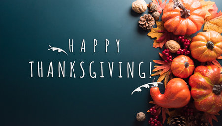 Thanksgiving and Autumn decoration concept made from autumn leaves and pumpkin with the text on dark background.の写真素材