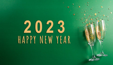 Happy New year celebration background concept made from champagne glass and the text on green...