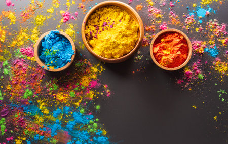 Happy Holi decoration, the indian festival.Top view of colorful holi powder on dark background.の写真素材