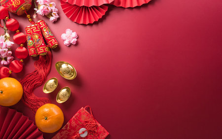 Chinese new year decorations made from red packet, orange and gold ingots or golden lump. Chinese characters FU on the object means to fortune, good luck, wealth, and money flow.の写真素材