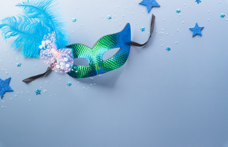Happy Purim carnival decoration concept made from mask and sparkle star and hamantaschen cookies on pastel background. (Happy Purim in Hebrew, jewish holiday celebrate)の写真素材