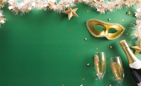 Happy Purim carnival decoration concept made from golden mask, wine, and sparkle star on green background. (Happy Purim in Hebrew, jewish holiday celebrate).の写真素材