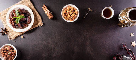 Ramadan Kareem background concept, Rosary bead with dates fruit and milk on dark stone background.の写真素材