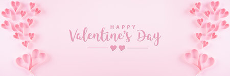 Pink paper hearts and the text on pastel paper background. Love and Valentine's day concept.の写真素材