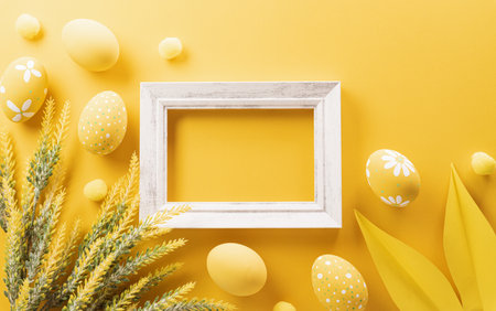 Happy easter! Colourful Easter eggs on yellow background. Decoration concept for greetings and presents on Easter Day celebrate time.の写真素材