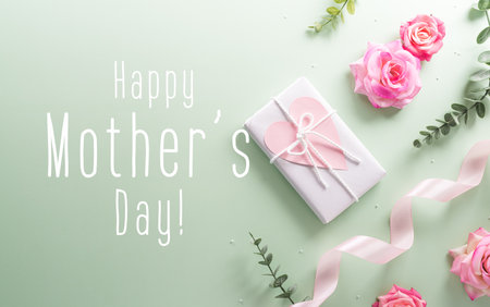 Happy Mother's day and Women's Day decoration concept made from flower gift box and the text on pastel background.の写真素材