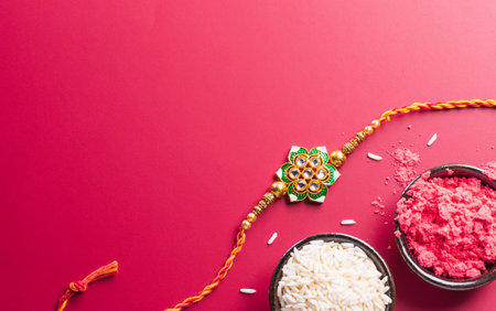 Raksha Bandhan, Indian festival with beautiful Rakhi and Rice Grains. A traditional Indian wrist band which is a symbol of love between Sisters and Brothersの写真素材