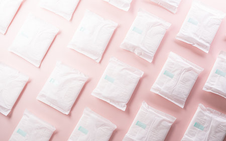 White sanitary pad on pastel background. Woman health or body positive concept.の写真素材