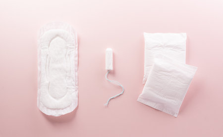 White sanitary pad on pastel background. Woman health or body positive concept.の写真素材