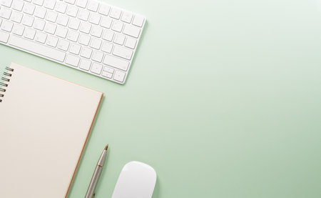 Flat lay, top view office table desk. Workspace with keyboard and office supplies on pastel background.の写真素材