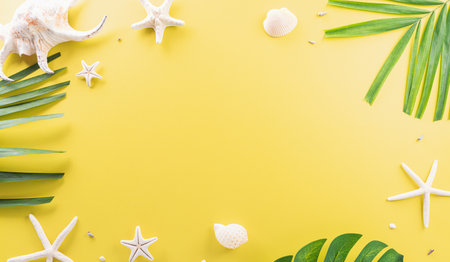 Summer composition concept made from starfish, sea shell and monstera leaf on pastel yellow background.の写真素材