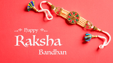 Raksha Bandhan, Indian festival with beautiful Rakhi on red background.  A traditional Indian wrist band which is a symbol of love between Sisters and Brothers.の写真素材