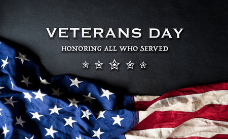 Happy Veterans day concept with flag of the United States and the text on black wooden background.の写真素材