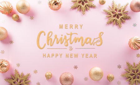 Christmas and new year background concept. Top view of Christmas ball, star and snowflake on pastel pink background.の写真素材