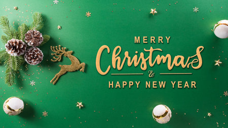 Christmas and new year background concept. Top view of christmas ball, reindeer, pine cone and snowflake on green background.の写真素材