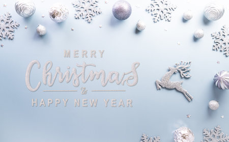 Christmas and new year background concept. Top view of Christmas star and snowflake on pastel blue background.の写真素材