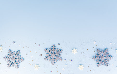 Christmas, winter and new year background concept. Top view of Christmas star and snowflake on pastel blue background.の写真素材