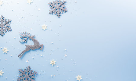 Christmas, winter and new year background concept. Top view of Christmas star and snowflake on pastel blue background.の写真素材