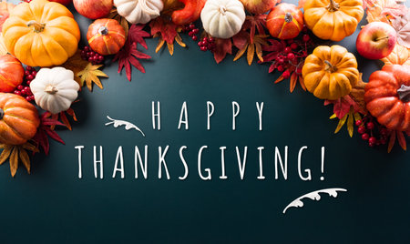 Thanksgiving and Autumn decoration concept made from autumn leaves and pumpkin on dark background.の写真素材