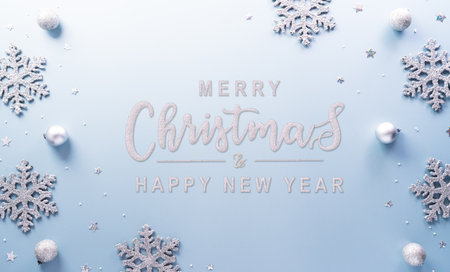 Christmas and new year background concept. Top view of Christmas star and snowflake on pastel blue background.の写真素材