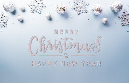 Christmas and new year background concept. Top view of Christmas star and snowflake on pastel blue background.の写真素材