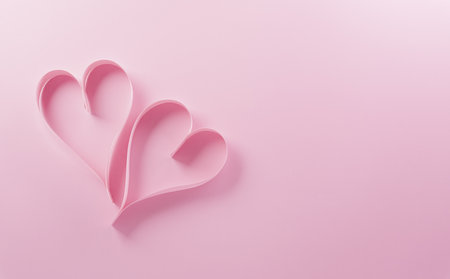Love and Valentine's day concept made from pink paper hearts on pastel background.の写真素材