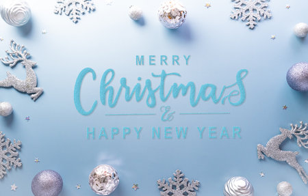 Christmas and new year background concept. Top view of Christmas star and snowflake on pastel blue background.の写真素材