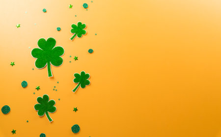 Happy St Patrick's Day decoration concept made from shamrocks ( clover leaf) on yellow background.の写真素材