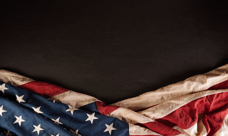Happy Independence Day. American flags against dark blackboard background. July 4.の写真素材