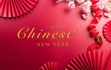 Chinese new year decorations made from plum blossom and gold ingots or golden lump. Chinese characters on the object means to fortune, good luck, wealth, and money flow.の写真素材